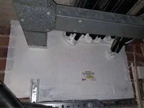 Coated board closing a service opening above a ceiling in a residential building